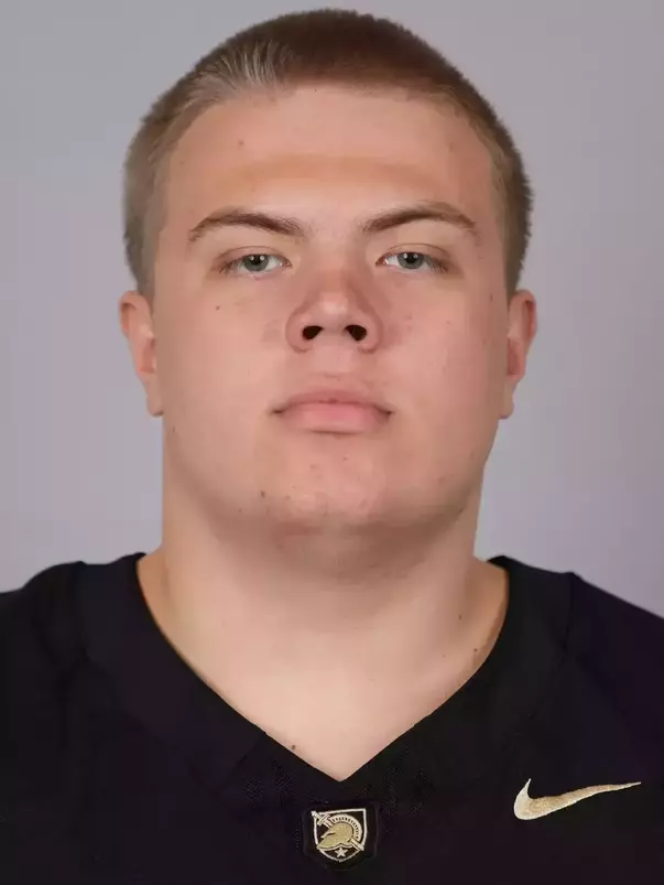 Tim Savchuk headshot with a Black Army Football jersey on.