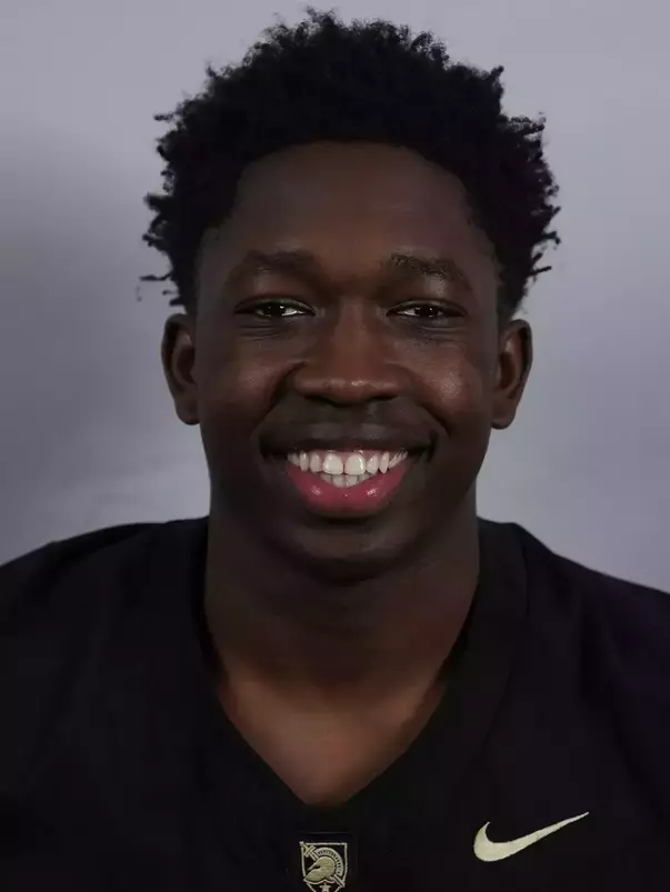 Tobi Olawole headshot with a Black Army Football jersey on.