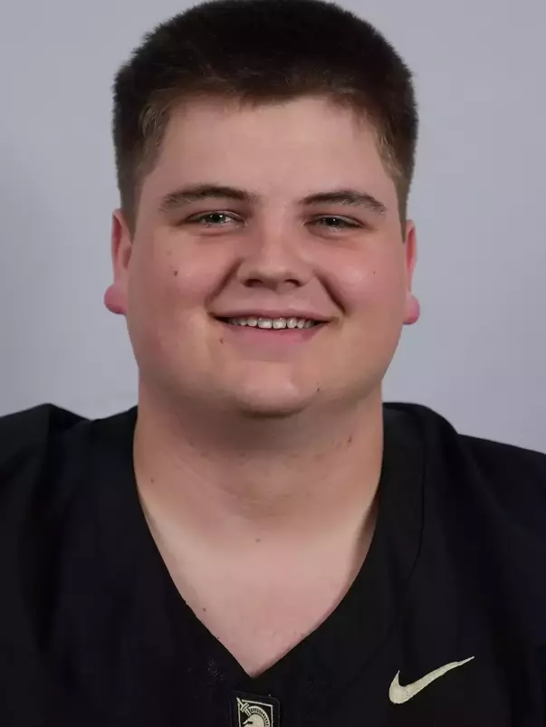 Wes Shaw headshot with a Black Army Football jersey on.
