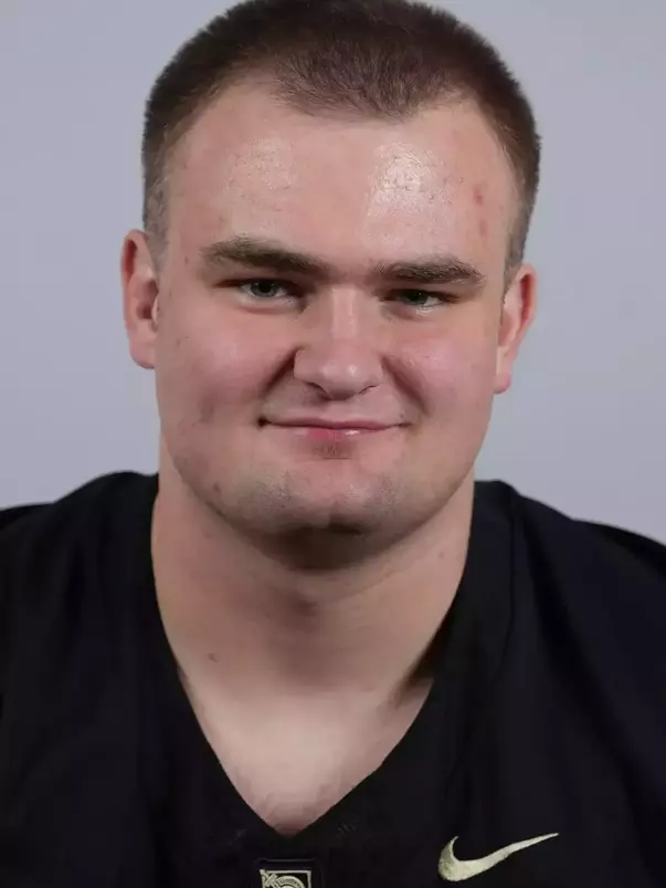 Will Jeffcoat headshot with a Black Army Football jersey on.