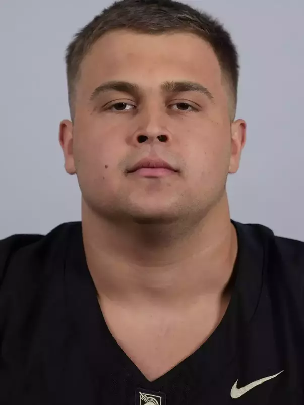 Xavier Archawski headshot with a Black Army Football jersey on.