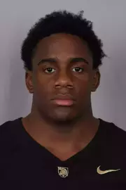 Xavier Ryan headshot with a Black Army Football jersey on.