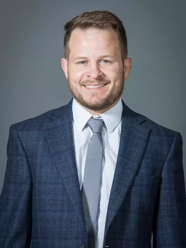 Troy Nickerson Headshot with a suit and tie on.