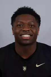 Ogordi headshot with a Black Army Football jersey on.