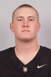 Miles Hagan headshot with a Black Army Football jersey on.