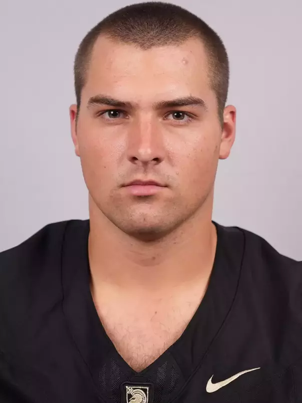 Jack Manning headshot with a Black Army Football jersey on.
