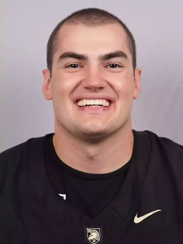 Ben Komopka headshot with a Black Army Football jersey on.