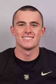 Andrew Astone headshot with a Black Army Football jersey on.
