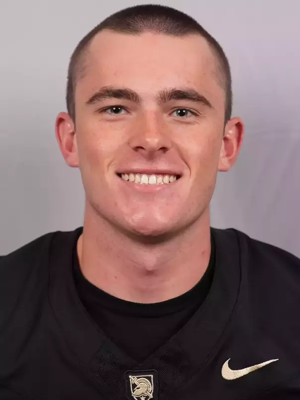 Andrew Astone headshot with a Black Army Football jersey on.