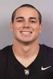 Tucker James headshot with a Black Army Football jersey on.