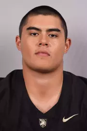 Carson Daniell Headshot with a Black Army Football jersey on.