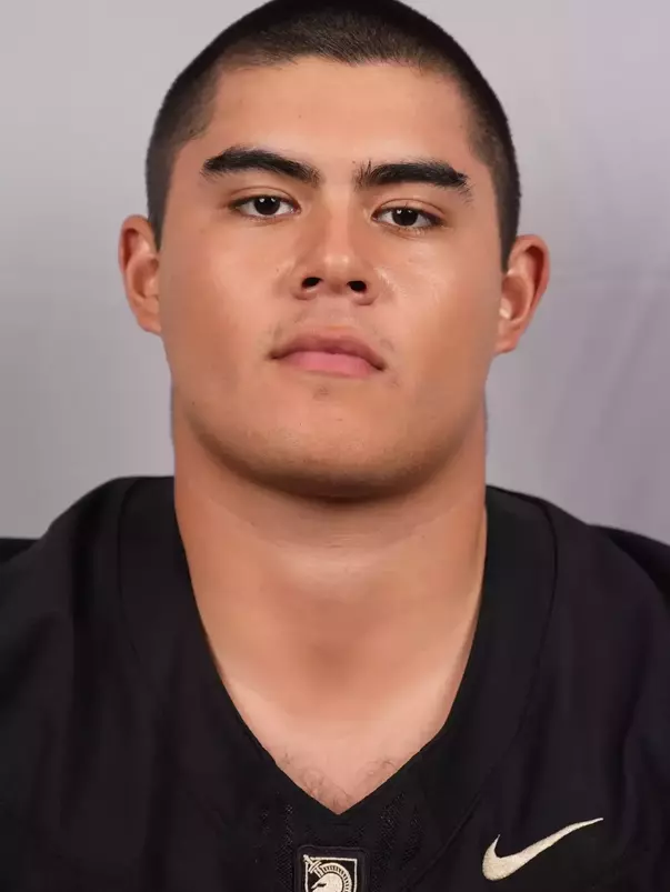 Carson Daniell Headshot with a Black Army Football jersey on.