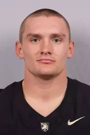 Ian Cline Headshot with a Black Army Football jersey on.