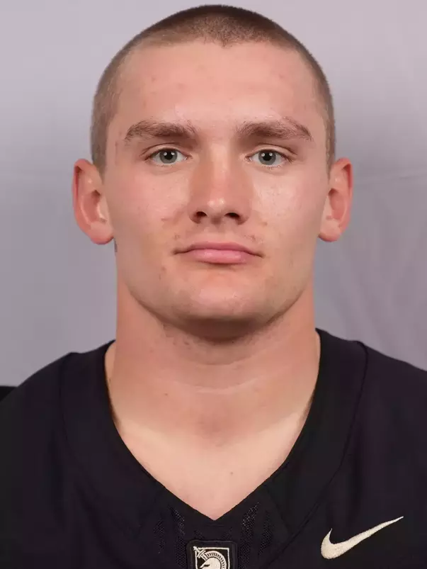 Ian Cline Headshot with a Black Army Football jersey on.