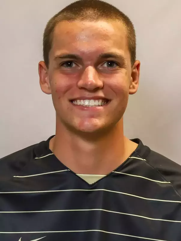 #19 Jack De Simone Headshot with soccer uniform on.