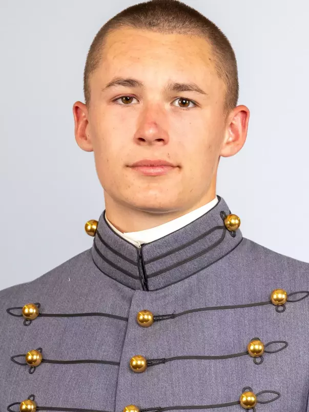 Kellye Riordan headshot with Cadet full dress gray on.