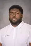 Jamiere Hogue headshot with a white polo on, assistant football coach