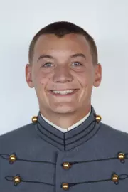 Matthew Archibald has his head shot photo taken.