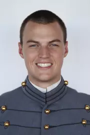 Nathan Olivier has head shot photo taken.