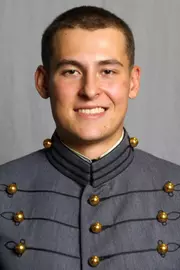Cam Charron has his 2026-27 headshot photo taken.