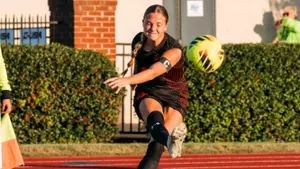Kaitlyn Vance kicks a corner during the semifinals against Liberty
