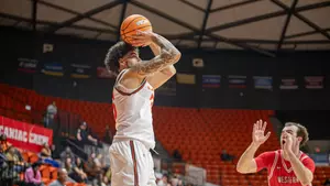 Po'Boigh King shoots over a WKU defender at Johnson Coliseum