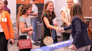 Haleigh Carter, Jordan Peno and Tricia Yarotsky take to an employer at last year's Career Fair