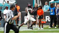 Williams Sets Miami Mark, Canes Top Louisville 52-27