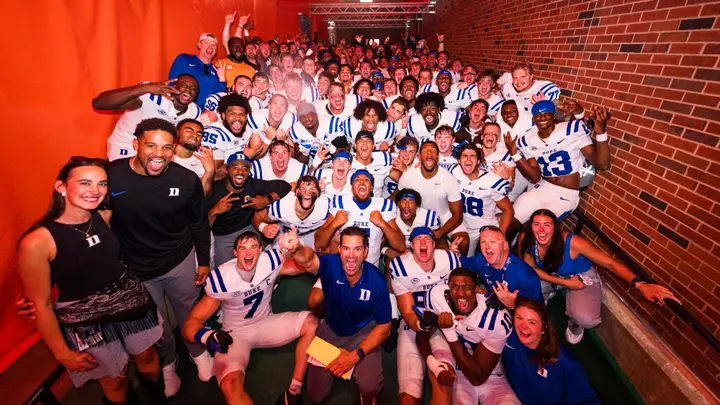 Duke football poses for a celebratory photo in the tunnel at Illinois after the Blue Devils' 2026 victory in Champaign.