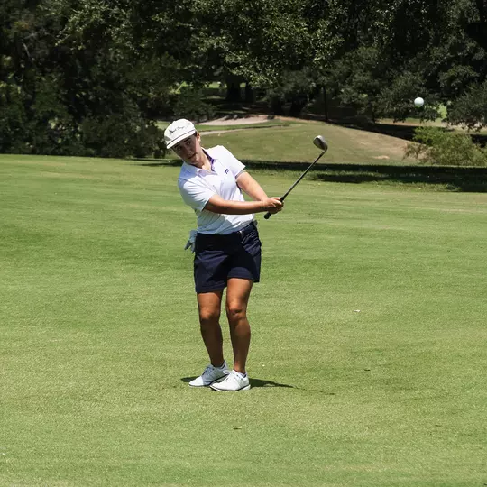 Claire Swathwood hits a wedge shot at Starr Hollow Golf Club