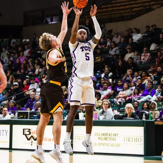 Micah Robinson shoots a 3-pointer against Wyoming.