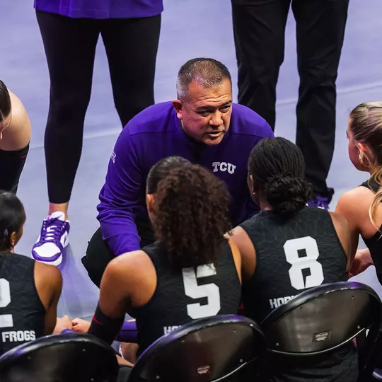 Jason Williams coaches the Frogs on the bench