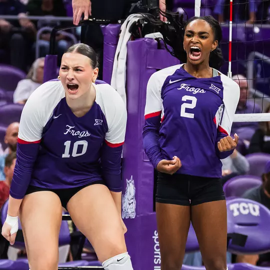 Kinsley Young and Evan Hendrix celebrate after a block against Colorado