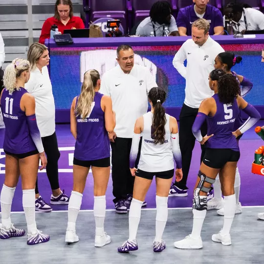 Volleyball team huddle against Kansas