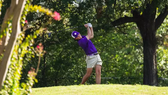 Cameron Kuchar swings through after teeing off.