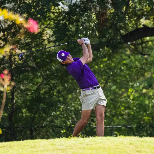Cameron Kuchar swings through after teeing off.