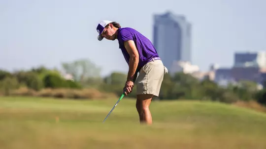 cameron kuchar lines up a putt