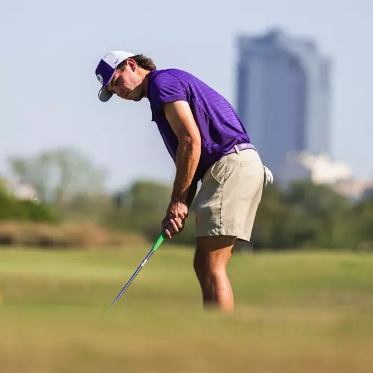 cameron kuchar lines up a putt