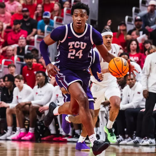 Xavier Edmonds drives down the court at Texas Tech.