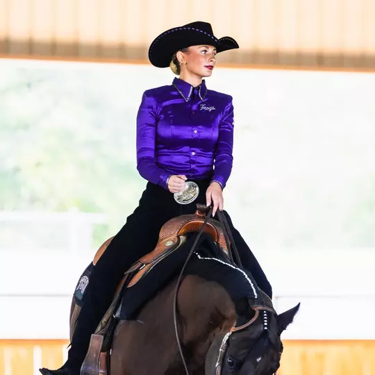Calla Thomas riding a horse
