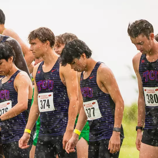 TCU cross country waits at the starting line in the rain
