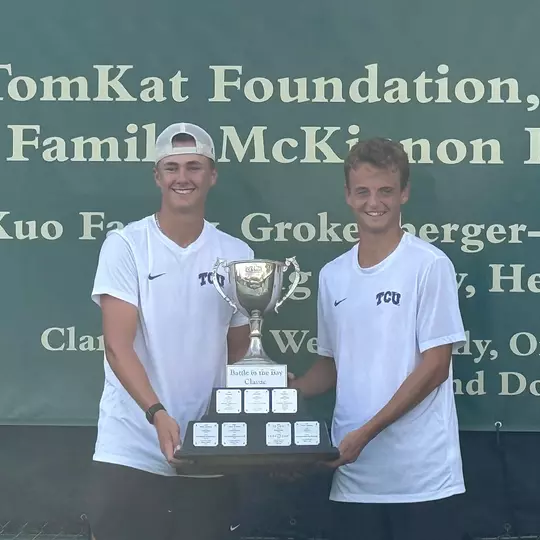 Matthieu Chambonniere and Maximus Dussault hold the Battle in the Bay Classic championship trophy