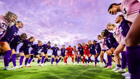 TCU women's soccer team huddle