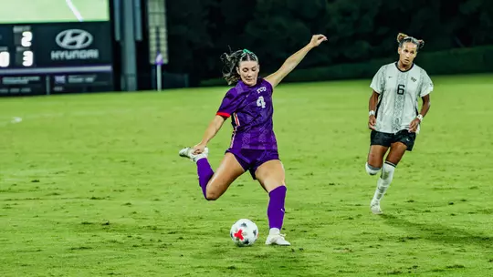 Zoe Cuneio kicking ball