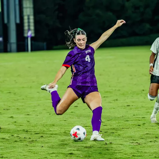 Zoe Cuneio kicking ball