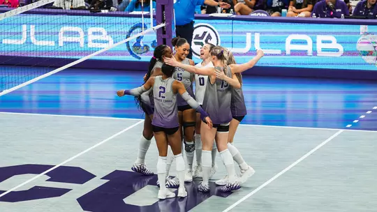 TCU Volleyball smiles and celebrates