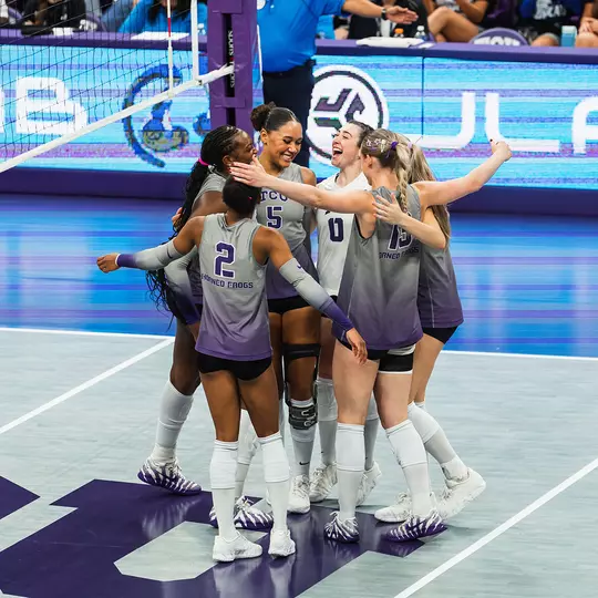 TCU Volleyball smiles and celebrates