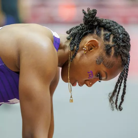 Amari Kiluvia getting ready for a race in the starting block.