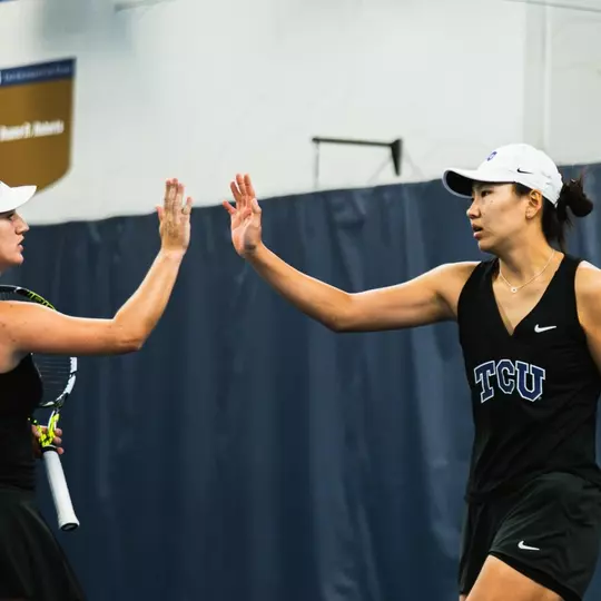 Yu-Chin Tsai and Victoria Gomez O'Hayon high-fiving