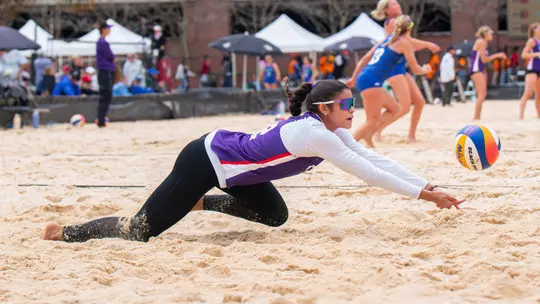 Marcela Mattoso diving for a ball
